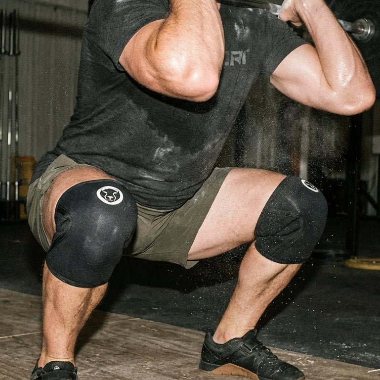 Athlete wearing Mammal V3 7mm knee sleeves mid heavy squat, alternate angle