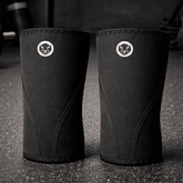 Mammal Stiff Knee Sleeves PRO, pair on gym floor