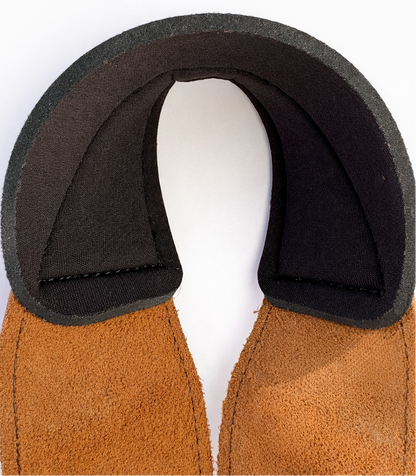 Close-up of a brown leather wrist support for weightlifting straps on a white background